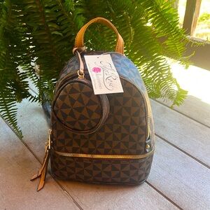 tyler rose accessories; double strapped leather bag with miniature pouch.